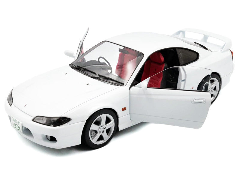White model car with open doors on a white background