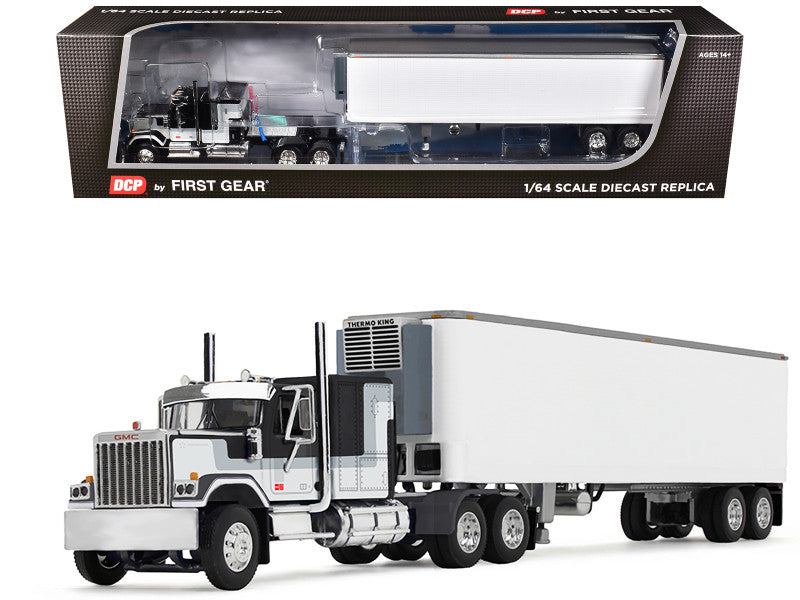 Model truck with trailer in front of its packaging box