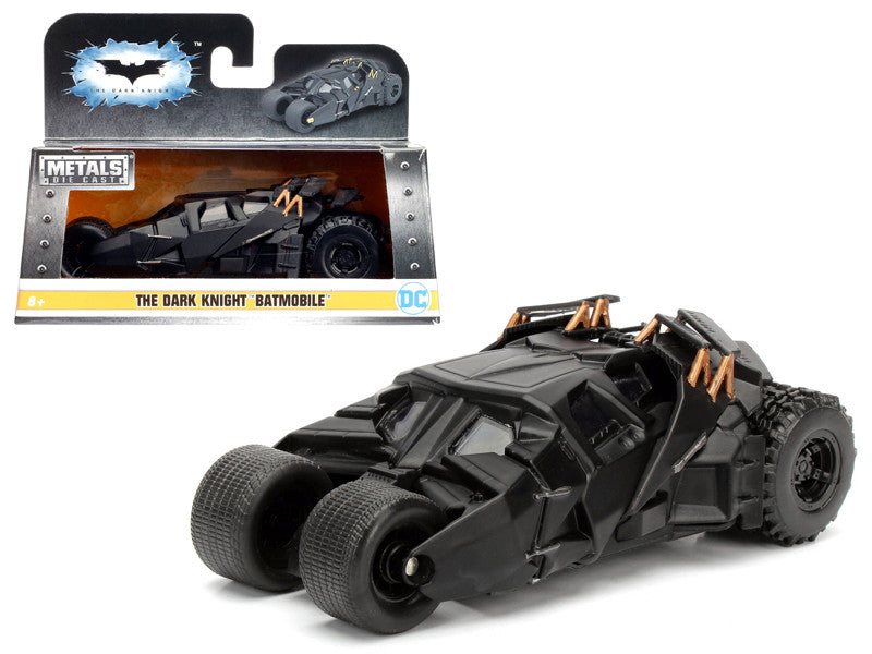 Toy Batmobile model with packaging on a white background