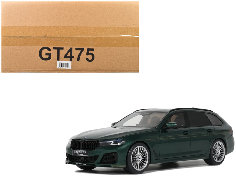Green BMW car next to a cardboard box with 'GT475' on a white background