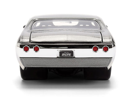Model car with chrome bumper and red taillights on a white background