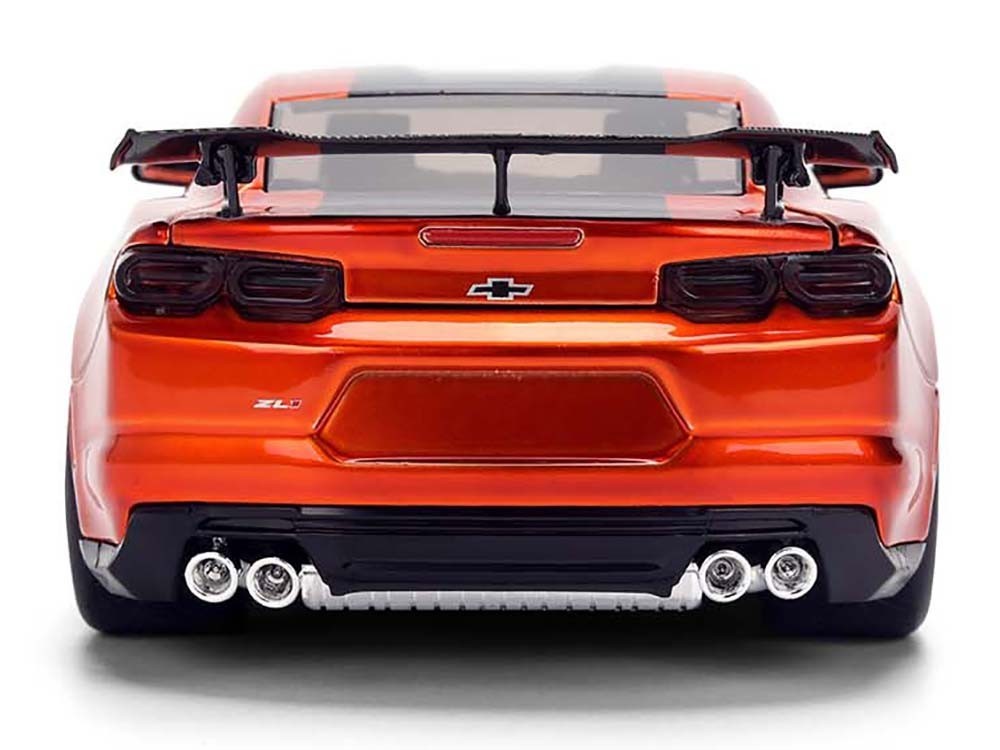 Orange Chevrolet car with a large rear wing on a white background