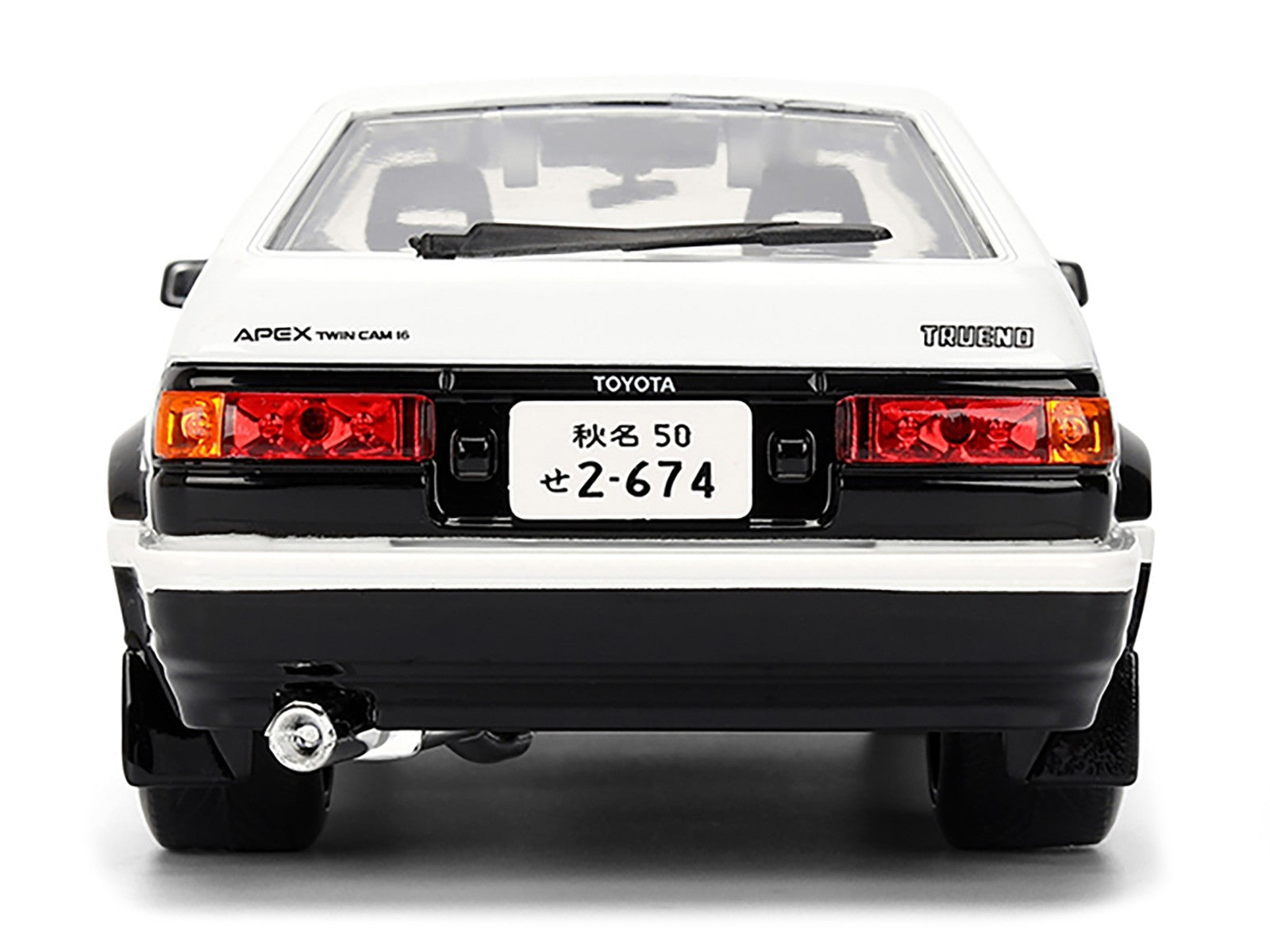 Back view of a Toyota car with visible branding on a white background