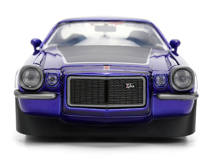 Front view of a blue classic car on a white background