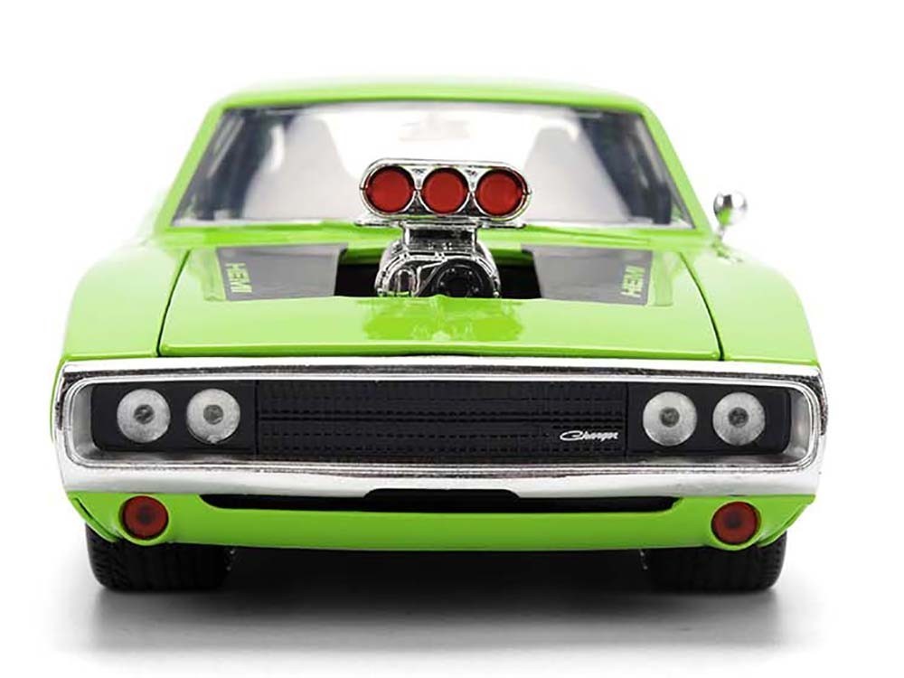 Green model car with a detailed engine on a white background