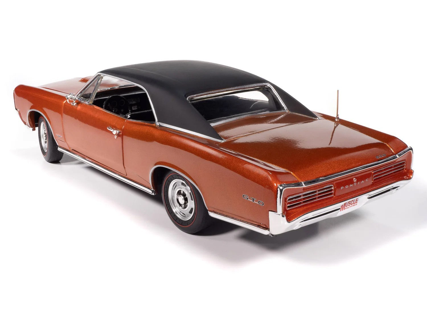 Model of a classic car with a brown body and black roof on a white background