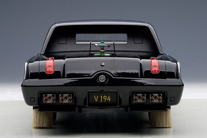 backend of a toy diecast car on gray background