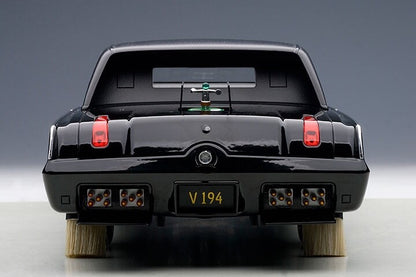 backend of a toy diecast car on gray background