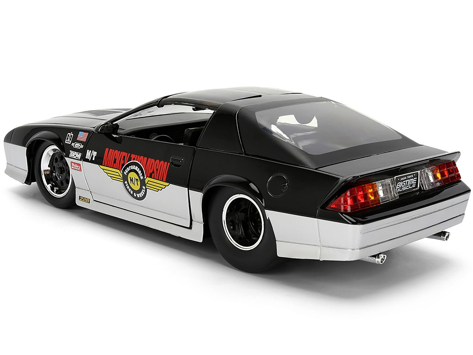 Black and white model car with visible branding on a white background