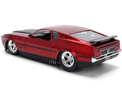 Red model car with black stripes on a white background