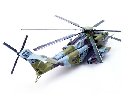 Model helicopter with camouflage design on a white background