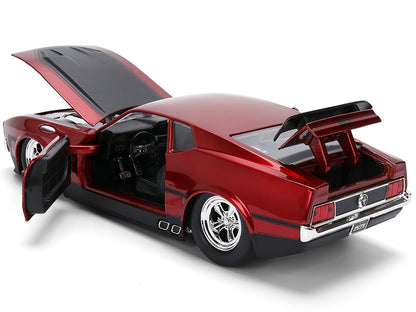 Red model car with open doors on a white background