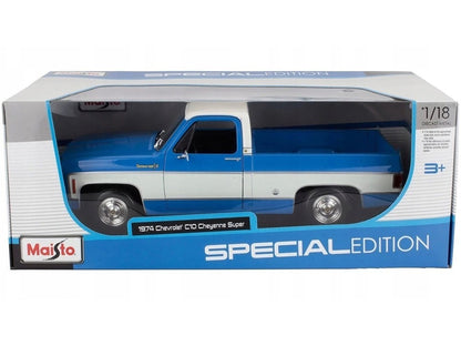Model truck in packaging with 'Maisto' branding on a white background
