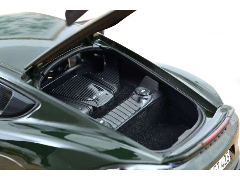 Open car hood with a focus on the engine compartment.
