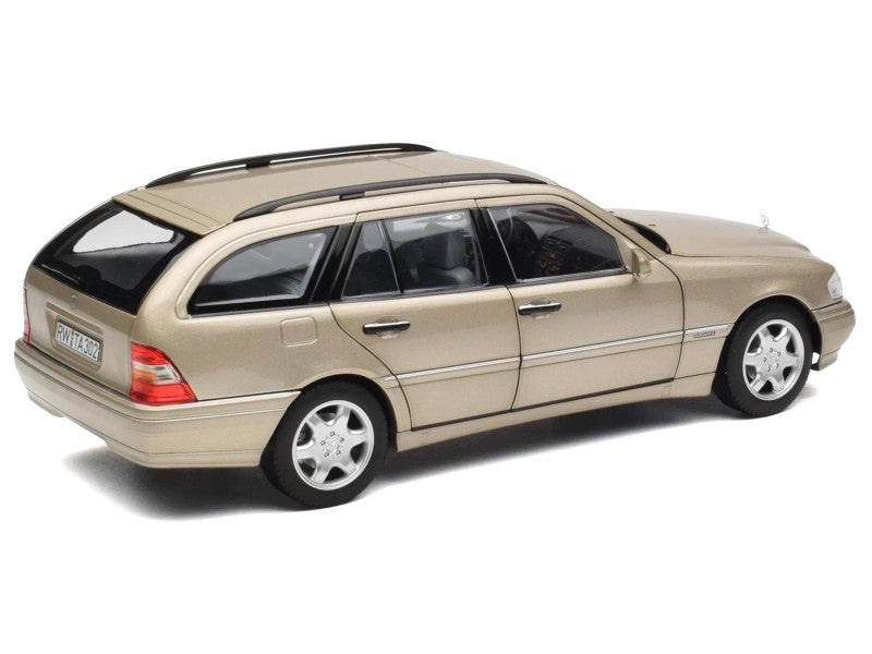 Model of a beige station wagon on a white background