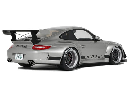 Silver sports car with a large rear wing on a white background
