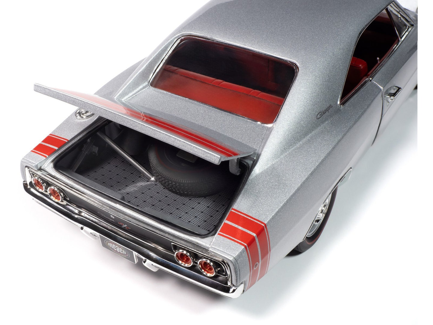 Close-up of a silver car with open trunk on a white background