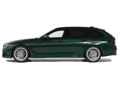 Green car side view on a white background