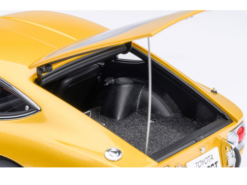 Yellow car with open trunk on a white background