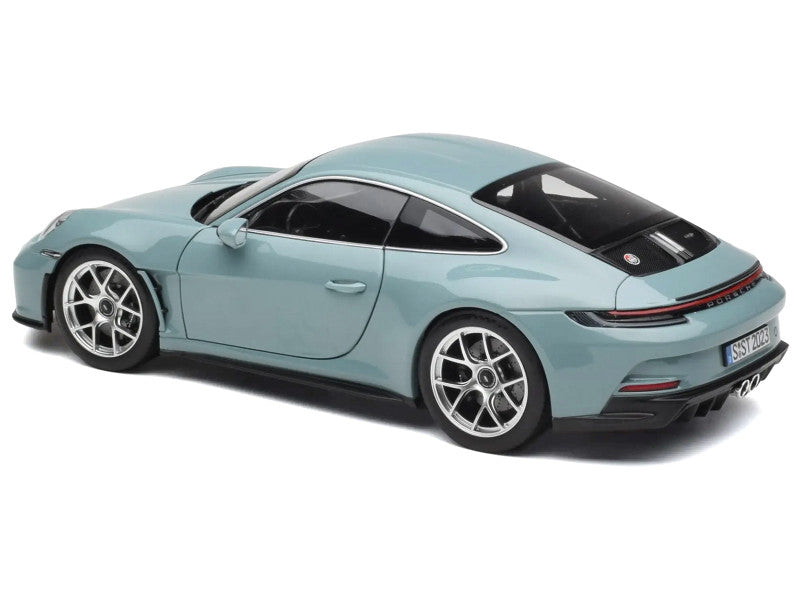 Light blue model car on a white background