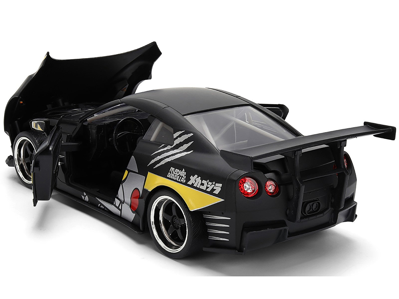 Black and yellow toy car with open doors on a white background