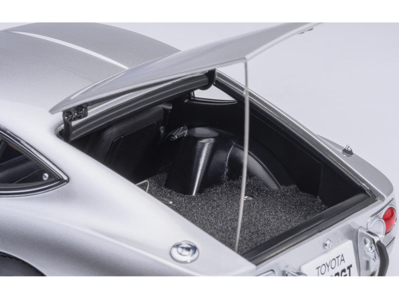 Open trunk of a silver Toyota car with visible interior and branding.