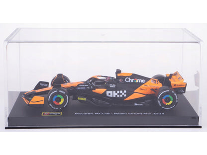 Model of a McLaren F1 car in a clear display case