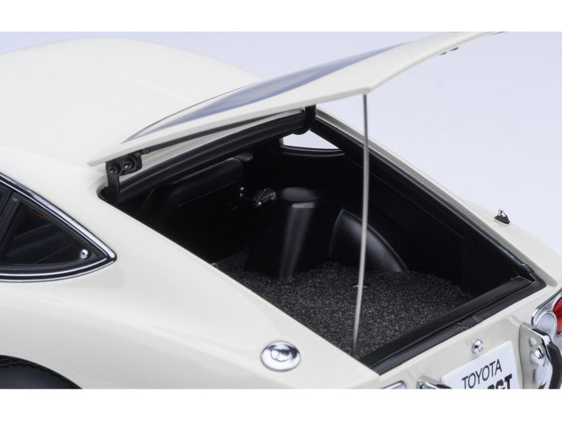 Open trunk of a white Toyota car with visible branding.