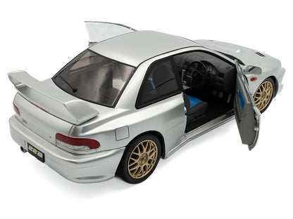 Model car with open door on a white background