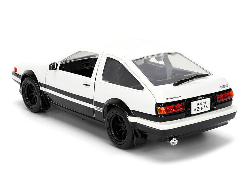 Model car of a white sports car with black stripes on a white background