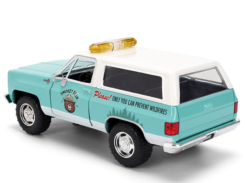 Model of a vintage truck with a light blue body and white roof on a white background