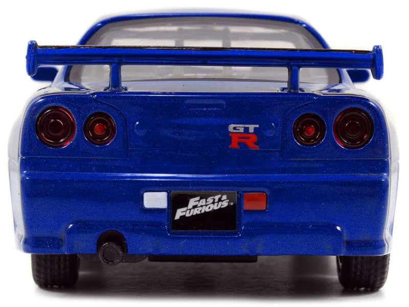 Blue toy car with 'GT R' and 'Fast & Furious' branding on a white background