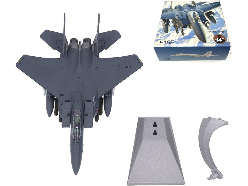 Model fighter jet kit with parts and packaging on a white background