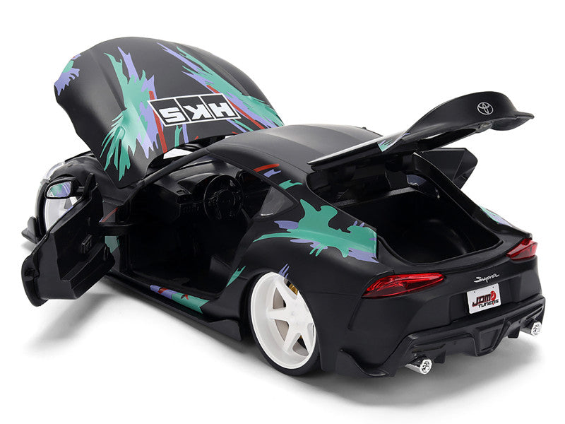 Black toy car with colorful design on a white background