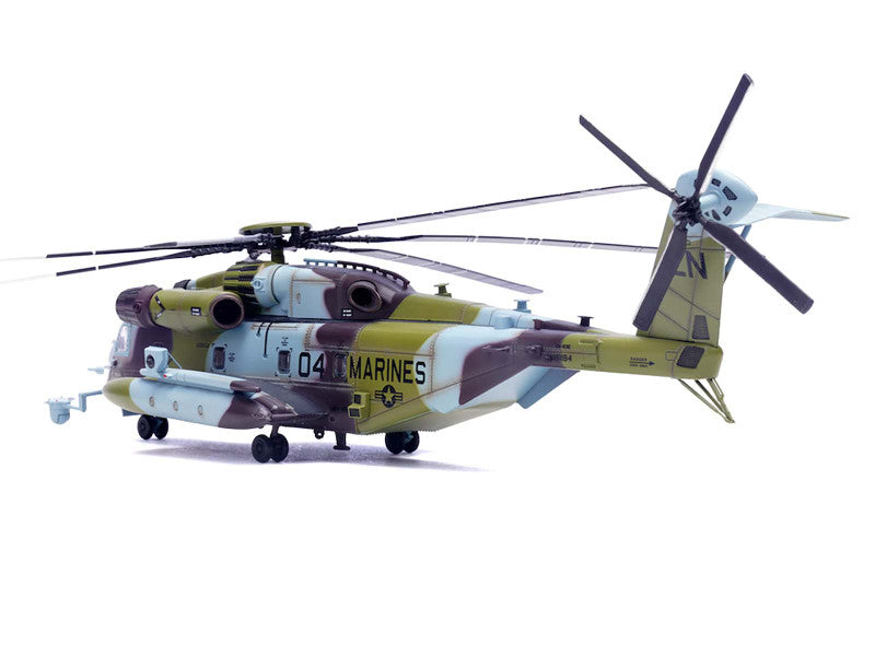 Model helicopter with camouflage design on a white background
