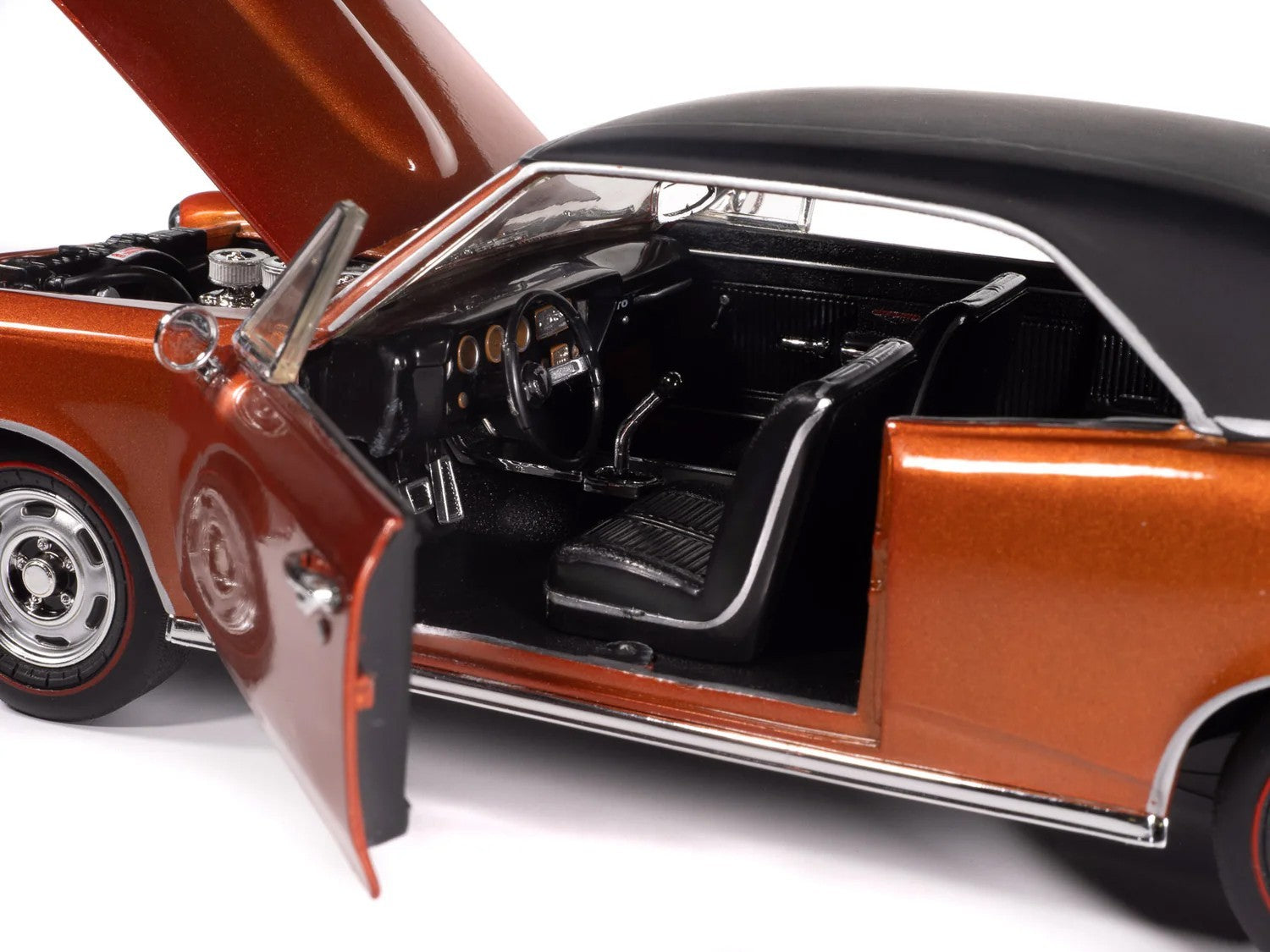 Model car with open door and hood on a white background