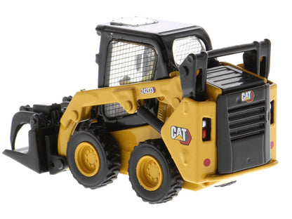 Toy skid steer loader with CAT branding on a white background
