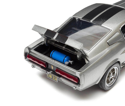 Model car with open trunk showing blue fuel tank on a white background