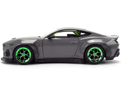 Gray sports car with green wheels on a white background