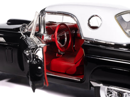 Model car with open door revealing red interior on a white background