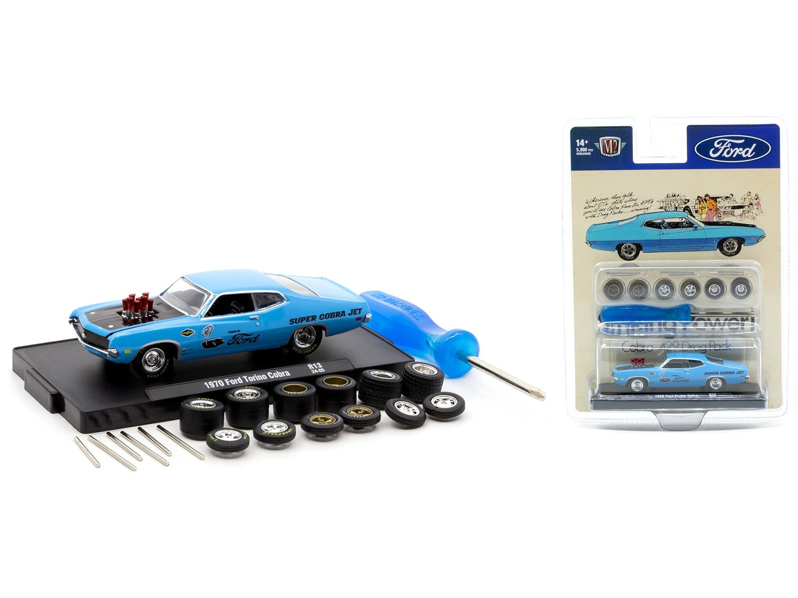 Model car kit with tools and packaging on a white background