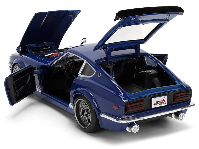 Blue model car with open doors and hood on a white background
