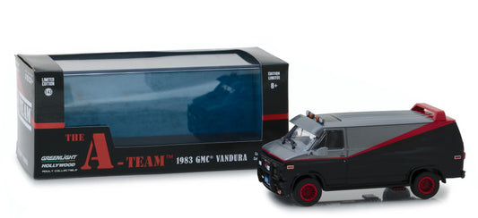 A 1/43 scale diecast model of a 1983 GMC Vandura from the TV series 'The A-Team', predominantly black with red accents, displayed alongside its packaging box.