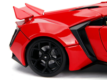 Red toy car with black wheels on a white background