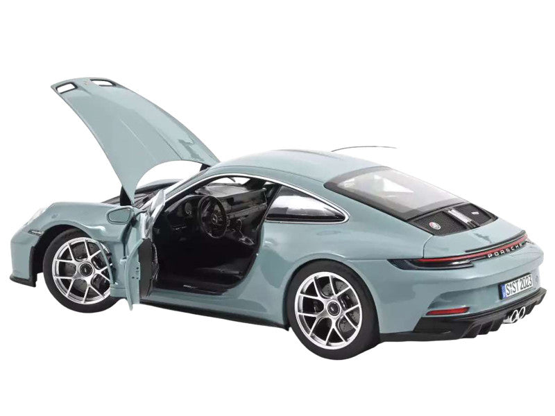 Model car of a sports car with open doors on a white background