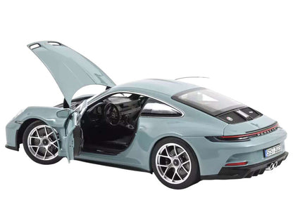 Model car of a sports car with open doors on a white background