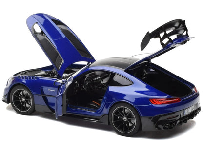 Blue sports car with open doors on a white background