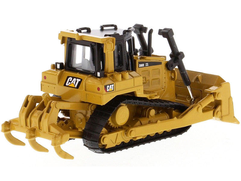 Toy bulldozer with CAT logo on a white background