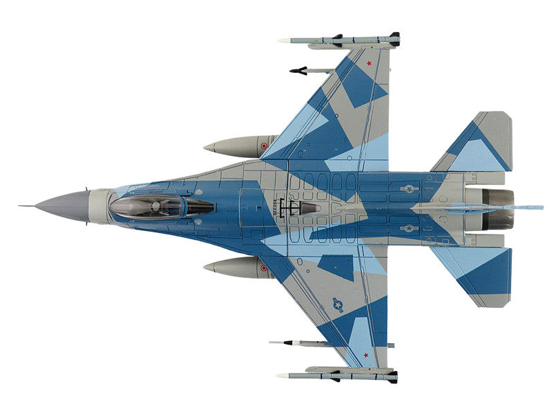 Camouflage fighter jet on a white background