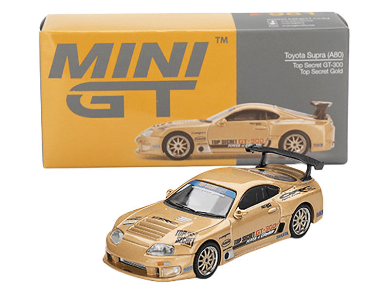 Model car of Toyota Supra with 'MINI GT' packaging on a white background